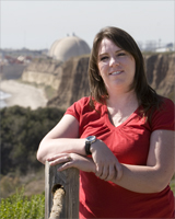 outdoor portrait, women leaning on post